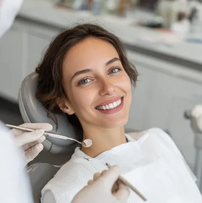 A patient smiling during a dental visit at Noho Dental Group
