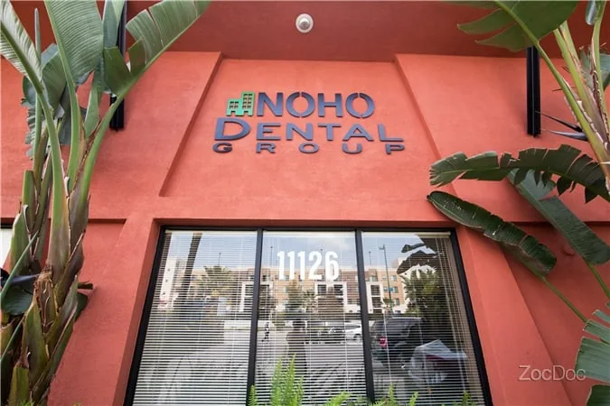 Building entrance with the NoHo Dental Group sign above the windows and the number 11126
