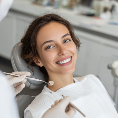 A patient smiling during a dental visit at Noho Dental Group