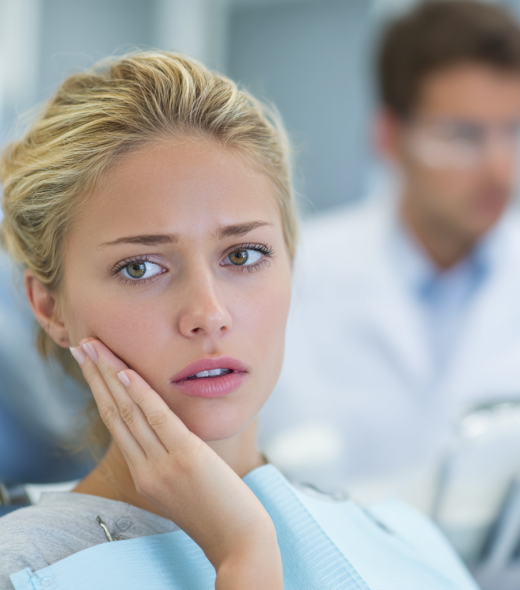 kiavallc_A_young_blonde_woman_sits_in_a_dental_chair_wearing_a__6067aa76-de9e-433b-87dc-2f741ad46159